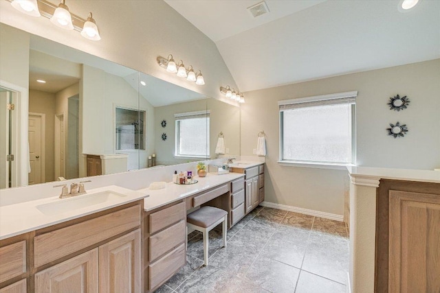 250 Nantucket Cir, Austin, TX 78737 - full bathroom featuring lofted ceiling, double vanity, baseboards, tile patterned floors, and a shower