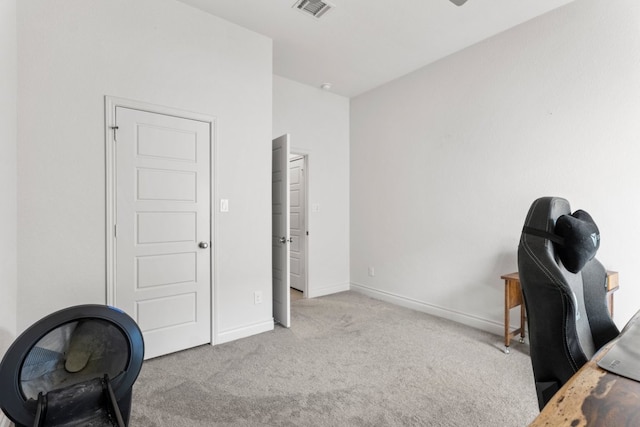 office featuring baseboards, visible vents, and carpet floors