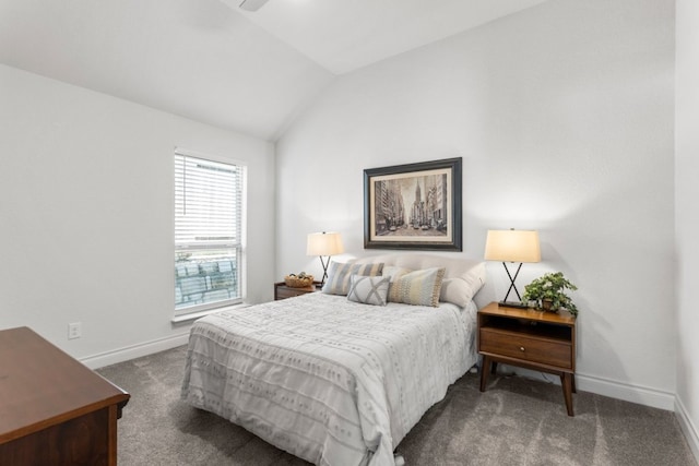 carpeted bedroom featuring lofted ceiling and baseboards