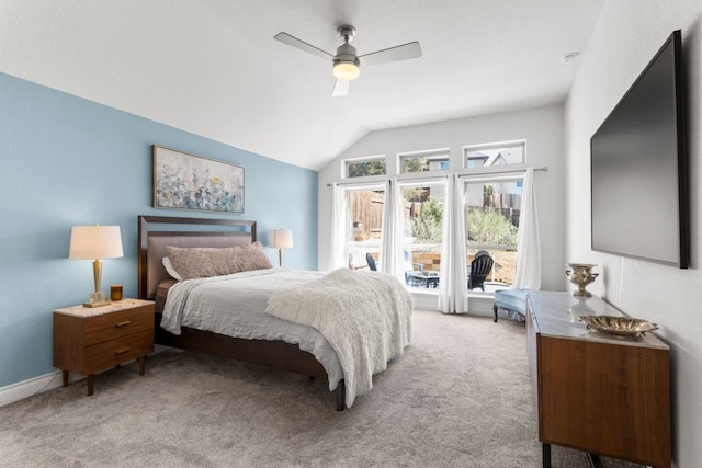 bedroom with light carpet, a ceiling fan, and vaulted ceiling