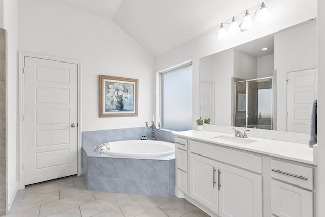 full bath featuring tile patterned floors, a garden tub, a shower stall, lofted ceiling, and vanity