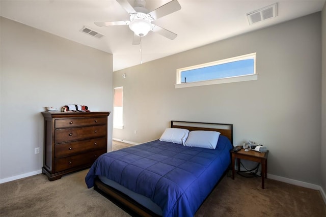 bedroom featuring baseboards, visible vents, and light carpet