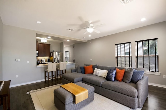 living area with visible vents, baseboards, recessed lighting, dark wood-style floors, and a ceiling fan