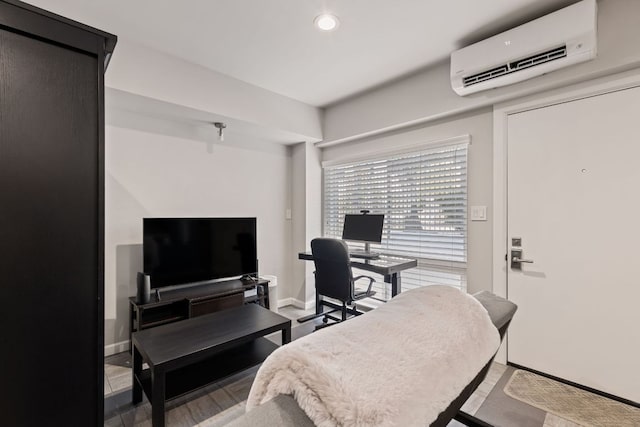 interior space featuring recessed lighting, baseboards, and a wall mounted air conditioner