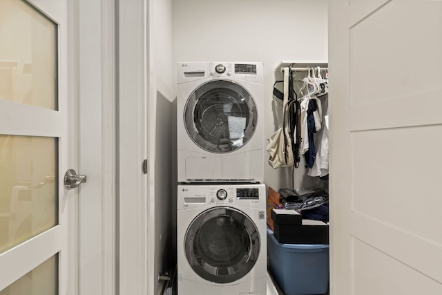 laundry area with stacked washer and clothes dryer