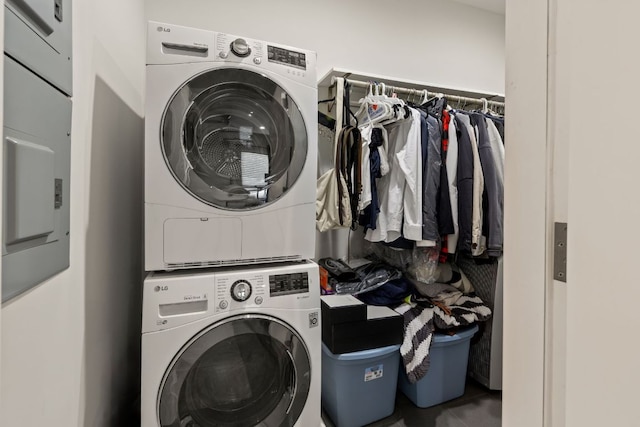 laundry area with laundry area and stacked washer and dryer