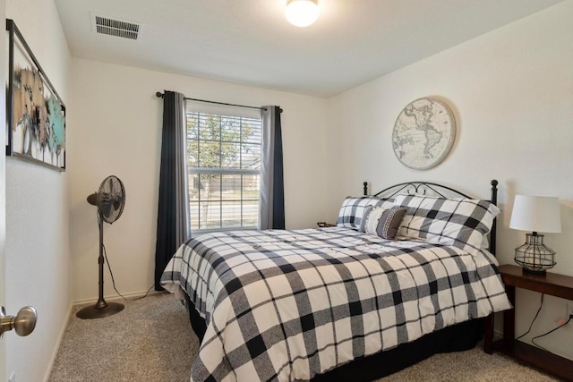 bedroom with visible vents, baseboards, and carpet