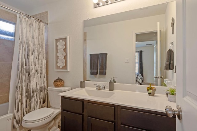 bathroom featuring vanity, toilet, and shower / tub combo with curtain