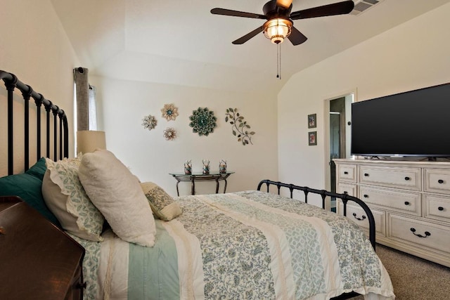 carpeted bedroom featuring vaulted ceiling, a ceiling fan, and visible vents