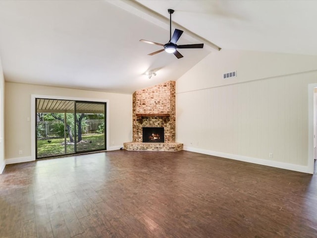 unfurnished living room featuring visible vents, dark wood-type flooring, ceiling fan, lofted ceiling with beams, and a fireplace