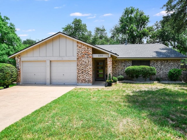 view of front of house featuring board and batten siding, a shingled roof, concrete driveway, a front yard, and a garage