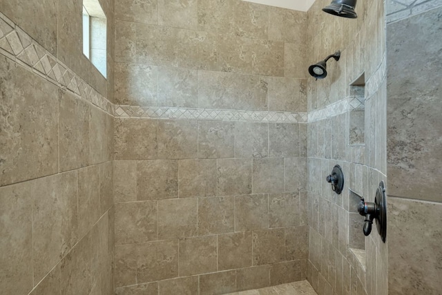 interior space with tiled shower