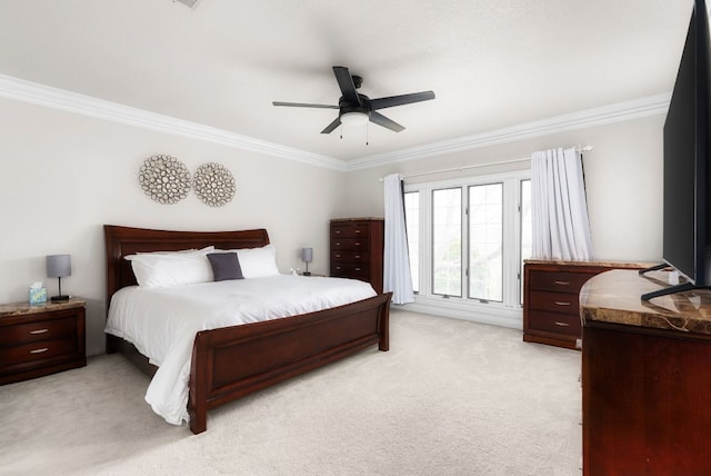 bedroom featuring ceiling fan, light colored carpet, and ornamental molding