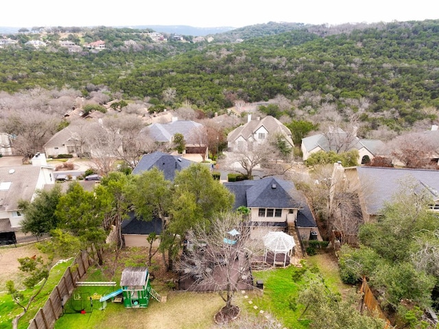 bird's eye view featuring a forest view and a residential view