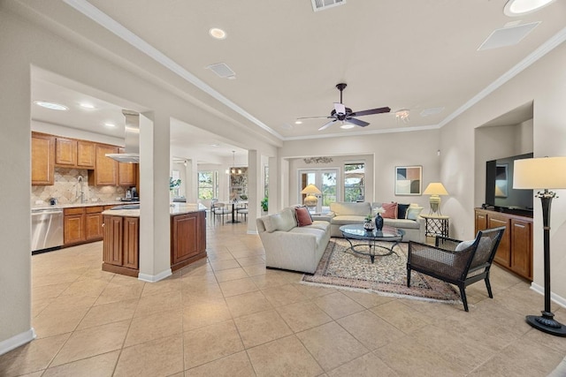 living room featuring crown molding, light tile patterned floors, a ceiling fan, and visible vents