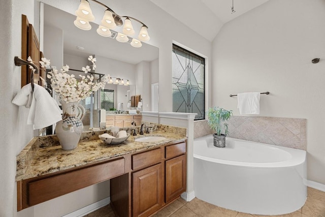 full bath with lofted ceiling, a garden tub, vanity, and tile patterned flooring