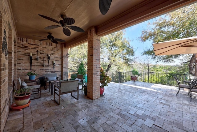 view of patio / terrace featuring ceiling fan and fence