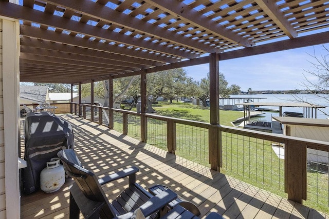 wooden deck featuring a pergola, a yard, and a water view