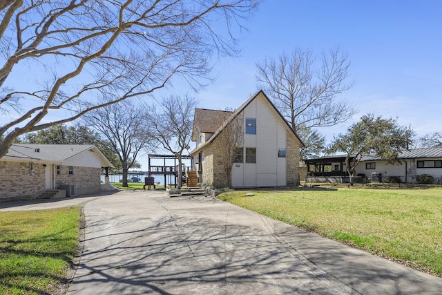 view of side of home featuring a lawn