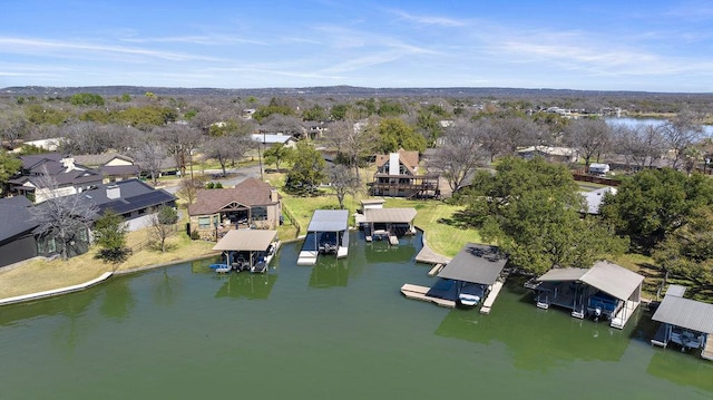 bird's eye view with a residential view and a water view