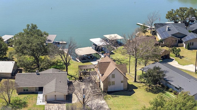 drone / aerial view featuring a residential view and a water view