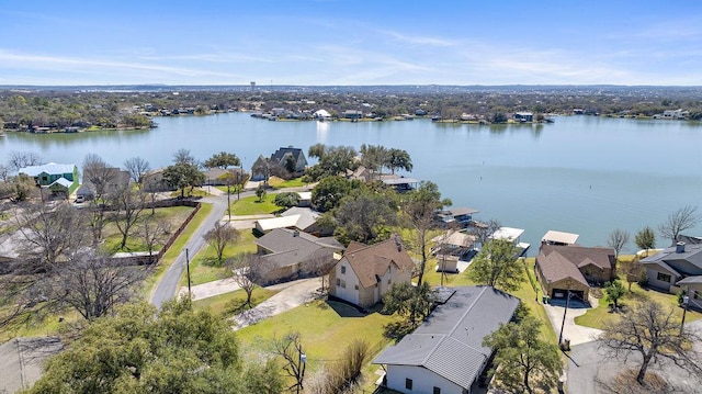 birds eye view of property with a residential view and a water view