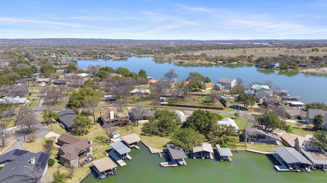 drone / aerial view with a residential view and a water view