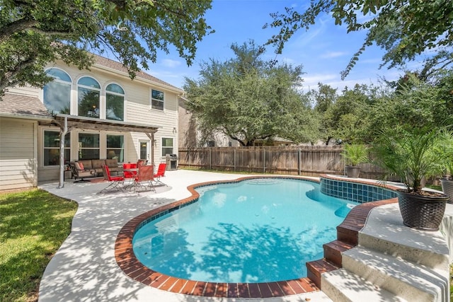 view of pool featuring a fenced in pool, a patio, a grill, and a fenced backyard