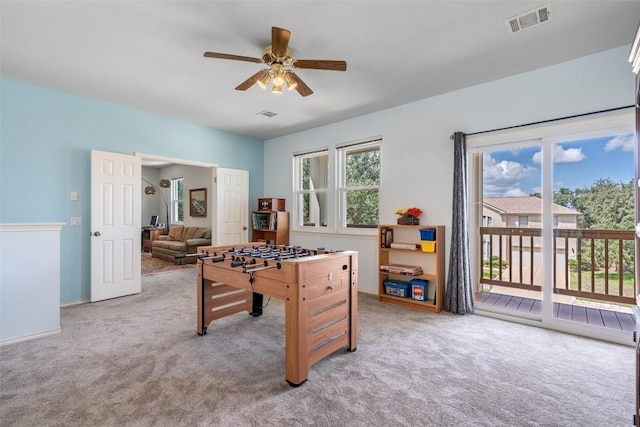 playroom with visible vents, ceiling fan, and carpet floors