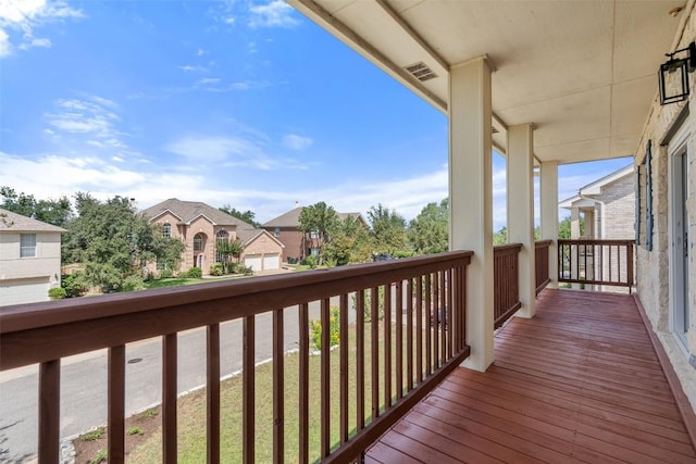 wooden terrace featuring a residential view