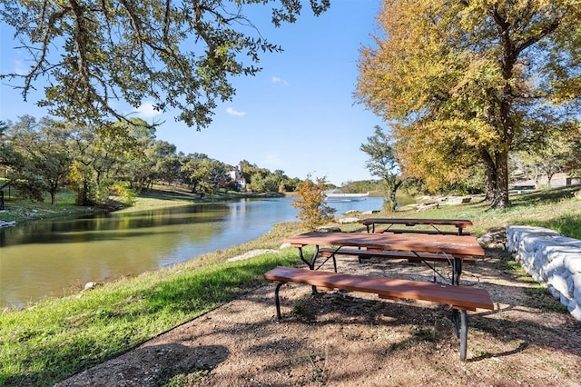 surrounding community with a water view