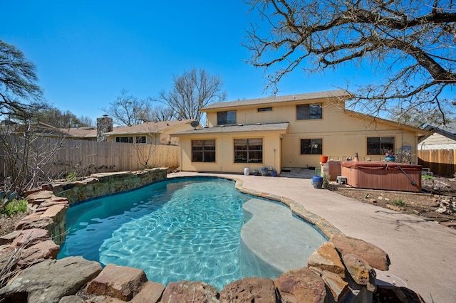 view of pool with a fenced in pool, a patio, a hot tub, and a fenced backyard