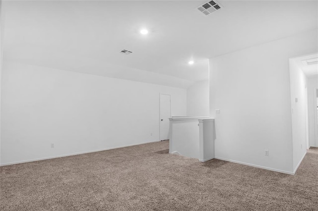 unfurnished room featuring carpet flooring, recessed lighting, and visible vents