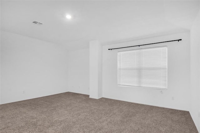 spare room with recessed lighting, visible vents, and carpet flooring