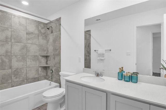 full bathroom with bathing tub / shower combination, visible vents, toilet, and vanity