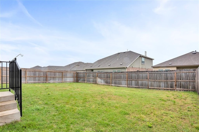 view of yard featuring a fenced backyard