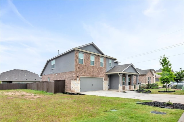 view of front of home featuring a front lawn, fence, concrete driveway, stone siding, and an attached garage