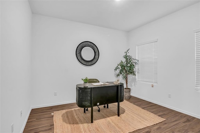 office space featuring wood finished floors and baseboards