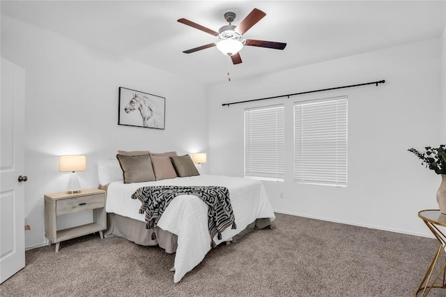 bedroom featuring baseboards, carpet floors, and a ceiling fan