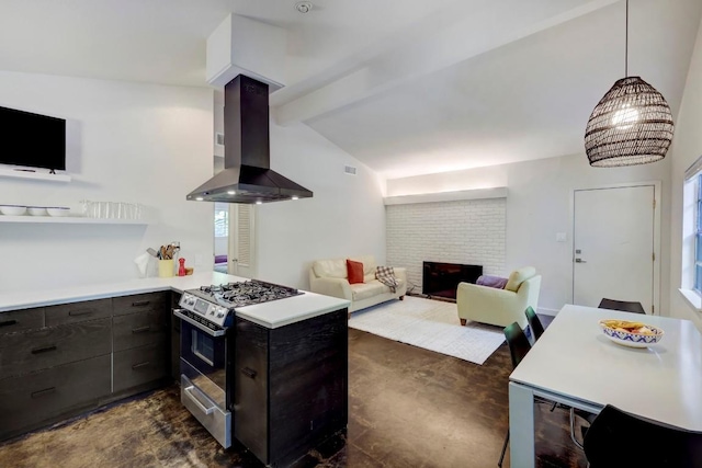 kitchen with ventilation hood, light countertops, gas range, a brick fireplace, and vaulted ceiling with beams