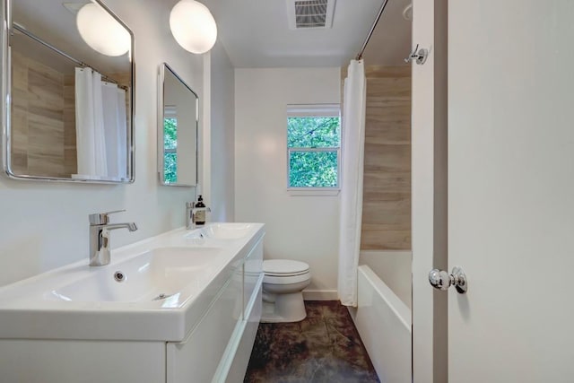 full bath with double vanity, toilet, visible vents, and a sink