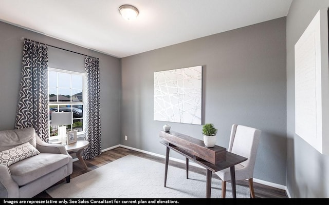 home office featuring baseboards and wood finished floors