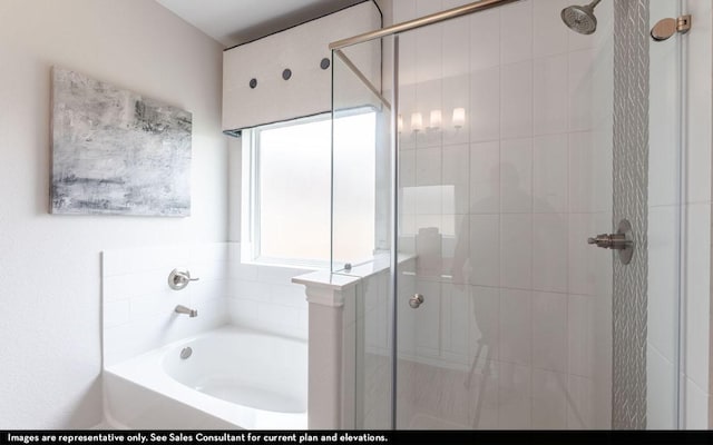 full bathroom featuring a stall shower and a garden tub