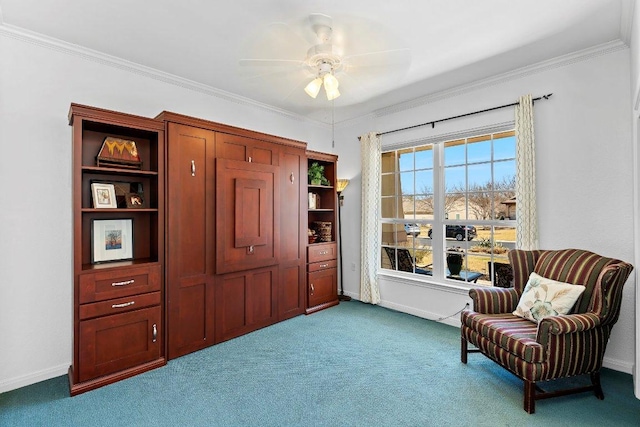 sitting room with crown molding, baseboards, carpet, and a ceiling fan