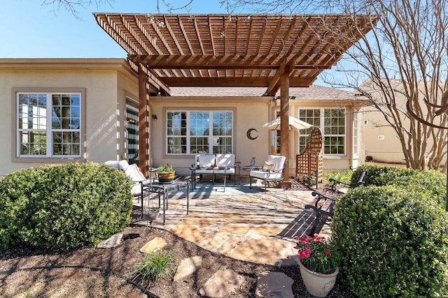 view of patio / terrace featuring outdoor lounge area and a pergola