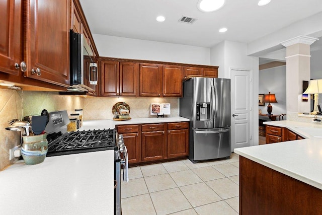 kitchen with visible vents, backsplash, appliances with stainless steel finishes, and light countertops