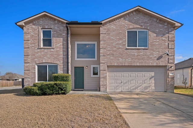 view of front of home with brick siding, a garage, and driveway