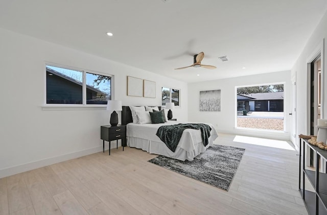 bedroom with visible vents, ceiling fan, baseboards, recessed lighting, and wood finished floors