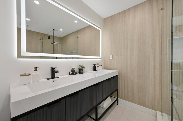 bathroom with a sink, double vanity, recessed lighting, and a shower stall