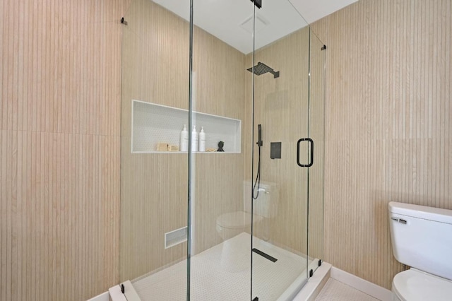 bathroom with visible vents, a shower stall, and toilet